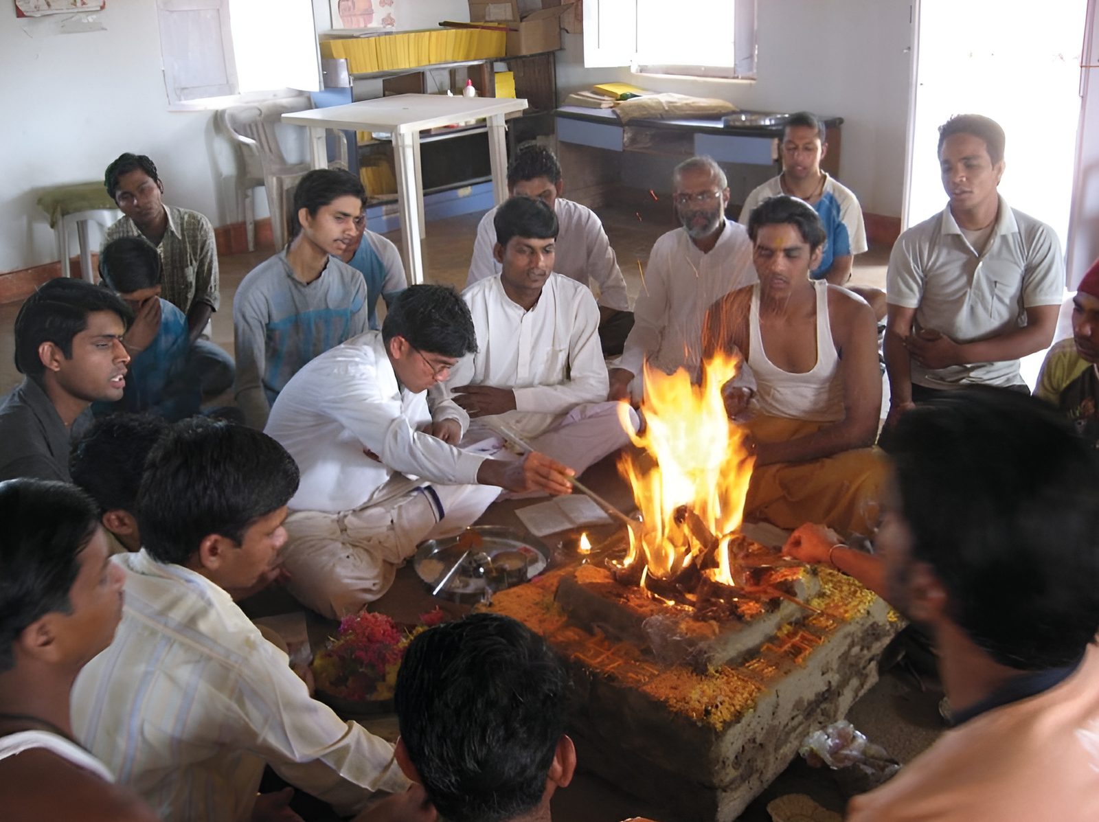 The Gayatri havan at the ashram. Students of the twentieth training batch seated around the brick havan-kunda in the ash